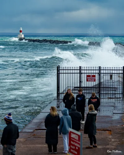 Waves crash into breakwater